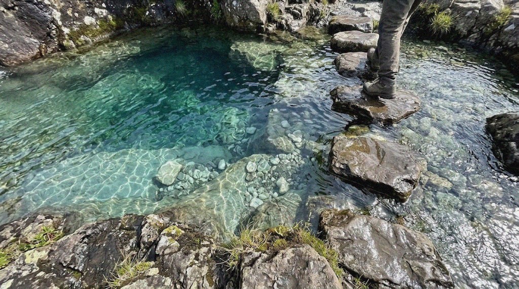 Clear pools over white pebbles
